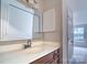 Well-lit bathroom featuring a framed mirror and a white countertop at 8115 Tremaine Ct, Charlotte, NC 28227