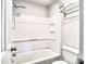 Cozy bathroom features a shower-tub combo with white tile surround at 8115 Tremaine Ct, Charlotte, NC 28227