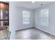 Bright dining area adjacent to the kitchen, featuring tiled floors and natural light at 8115 Tremaine Ct, Charlotte, NC 28227