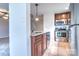 Updated kitchen with stainless steel appliances and granite countertops near the living area at 8115 Tremaine Ct, Charlotte, NC 28227