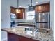 Modern kitchen featuring stainless steel appliances, granite counters and stylish pendant lighting at 8115 Tremaine Ct, Charlotte, NC 28227