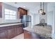 Well-appointed kitchen area showcasing stainless steel appliances and granite countertops at 8115 Tremaine Ct, Charlotte, NC 28227