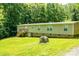 Expansive yard with mature trees, offering tranquility and privacy, ideal for outdoor relaxation and activities at 812 Acclaim Dr, York, SC 29745