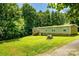 Expansive yard with mature trees, offering tranquility and privacy, ideal for outdoor relaxation and activities at 812 Acclaim Dr, York, SC 29745