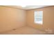 Well-lit bedroom with neutral walls and carpet, and a window with horizontal blinds at 812 Acclaim Dr, York, SC 29745
