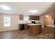 Well-lit kitchen featuring modern appliances, laminate counters, and wood cabinets at 812 Acclaim Dr, York, SC 29745