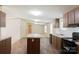 Bright kitchen featuring a center island, laminate counters, and wood cabinets at 812 Acclaim Dr, York, SC 29745