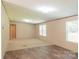Spacious living room featuring wood-look flooring and ample natural light from the windows at 812 Acclaim Dr, York, SC 29745