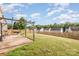 Large backyard with wooden fence, featuring patio with pergola and grill area, perfect for outdoor entertaining at 9822 Bayview Pkwy, Charlotte, NC 28216
