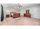 Well-lit bedroom with neutral walls, carpet, and wooden furniture at 9822 Bayview Pkwy, Charlotte, NC 28216