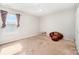 Bedroom with neutral walls, ceiling fan, carpet, and a football chair at 9822 Bayview Pkwy, Charlotte, NC 28216