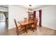 Dining area features wooden table set, matching hutch, and a decorative light fixture at 9822 Bayview Pkwy, Charlotte, NC 28216