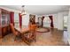 View of dining room with wood table set, china hutch and a comfortable seating area at 9822 Bayview Pkwy, Charlotte, NC 28216