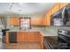 Well-lit kitchen with wood cabinets, modern appliances, and practical countertops at 9822 Bayview Pkwy, Charlotte, NC 28216