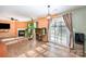 Open living room with wood floors, sliding glass doors, fireplace and decor at 9822 Bayview Pkwy, Charlotte, NC 28216
