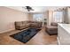 Comfortable living room with sectional sofa, ceiling fan, and lots of natural light at 9822 Bayview Pkwy, Charlotte, NC 28216