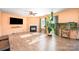 Inviting living room with a cozy fireplace and large windows that fill the room with natural light at 9822 Bayview Pkwy, Charlotte, NC 28216