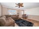 Cozy living room with ceiling fan, comfortable seating, and lots of natural light at 9822 Bayview Pkwy, Charlotte, NC 28216