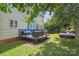 Spacious backyard deck with cozy seating, perfect for outdoor entertaining at 9954 Mitchell Glen Dr, Charlotte, NC 28277