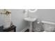 Small bathroom with a pedestal sink, neutral wall color and classic fixtures at 9954 Mitchell Glen Dr, Charlotte, NC 28277