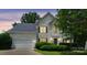 Charming two-story home with well-maintained landscaping, a two-car garage, and inviting curb appeal at 9954 Mitchell Glen Dr, Charlotte, NC 28277