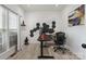 Bright home office with modern decor, wood floors, and a large window at 9954 Mitchell Glen Dr, Charlotte, NC 28277