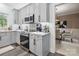 Modern kitchen with gray cabinets, quartz countertops, and stainless steel appliances at 9954 Mitchell Glen Dr, Charlotte, NC 28277