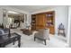 Open living area featuring hardwood cabinets, neutral furniture, and dining room view at 9954 Mitchell Glen Dr, Charlotte, NC 28277