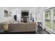 Inviting living room featuring a stone fireplace and abundant natural light at 9954 Mitchell Glen Dr, Charlotte, NC 28277