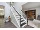 Staircase with dark wood treads and white risers leading to the upper level at 9954 Mitchell Glen Dr, Charlotte, NC 28277