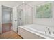 Bathroom features a soaking tub and separate glass shower at 10009 Community House Rd, Charlotte, NC 28277
