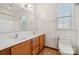 Bright bathroom featuring a double sink vanity and a large mirror at 10009 Community House Rd, Charlotte, NC 28277