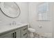 Bathroom features a patterned tile floor, modern vanity and plenty of natural light at 10009 Community House Rd, Charlotte, NC 28277