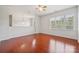 Bonus room with hardwood floors, plenty of natural light and pendant lighting at 10009 Community House Rd, Charlotte, NC 28277