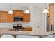 Stylish kitchen featuring granite countertops, stainless steel appliances, and wooden cabinets at 10009 Community House Rd, Charlotte, NC 28277