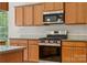 Modern kitchen with stainless steel appliances, granite countertops, and subway tile backsplash at 10009 Community House Rd, Charlotte, NC 28277