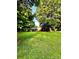 Spacious backyard with mature shade trees and well-manicured lawn at 114 Huffstetler Rd, Gastonia, NC 28056