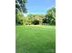 A spacious backyard surrounded by mature trees, offering a peaceful outdoor retreat at 114 Huffstetler Rd, Gastonia, NC 28056