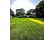 Expansive backyard with mature trees and well-maintained lawn, perfect for outdoor activities at 114 Huffstetler Rd, Gastonia, NC 28056