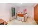 Cozy bedroom featuring pink walls, a bed, and a window with natural light at 114 Huffstetler Rd, Gastonia, NC 28056