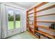 Bedroom featuring a large window and wood shelving to display books and decor at 114 Huffstetler Rd, Gastonia, NC 28056