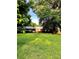 Charming brick home nestled on a lush, expansive green lawn with mature trees at 114 Huffstetler Rd, Gastonia, NC 28056