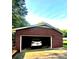 Spacious brick garage with ample room for parking and storage, showcasing a vehicle inside at 114 Huffstetler Rd, Gastonia, NC 28056