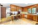 Charming kitchen featuring wooden cabinetry and tile flooring at 114 Huffstetler Rd, Gastonia, NC 28056