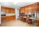 Functional kitchen featuring wooden cabinetry and an adjacent dining area at 114 Huffstetler Rd, Gastonia, NC 28056