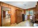 Laundry room with wood walls, large storage cabinet and washer/dryer at 114 Huffstetler Rd, Gastonia, NC 28056