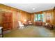 Spacious living room with hardwood walls, natural light and comfortable rocking chairs at 114 Huffstetler Rd, Gastonia, NC 28056