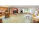 Open living area with fireplace, dining table, sofas, and hardwood accents at 114 Huffstetler Rd, Gastonia, NC 28056