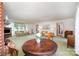 Open living room with fireplace, sofas, natural light, and views to the yard at 114 Huffstetler Rd, Gastonia, NC 28056