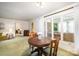 Living room showcasing a round table, large windows, and access to other rooms at 114 Huffstetler Rd, Gastonia, NC 28056